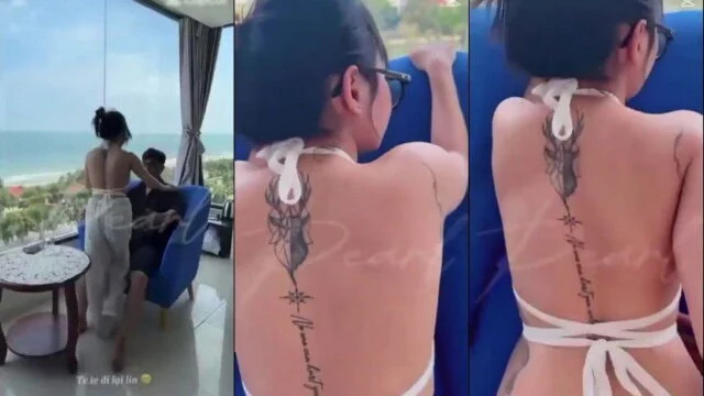 Phang em sinh viên đeo kính bên khung cửa